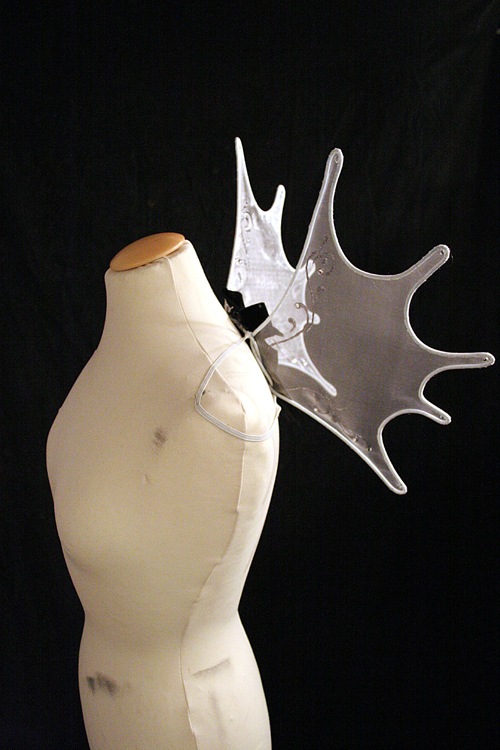 Sideview of the wings on a dressform