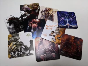 coasters displaying random artworks like patch art, monsters or expansion artworks in eorzea cafe