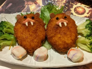croquettes in the shape of the great beaver critter in final fantasy 14 in eorzea cafe tokyo